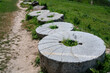 Ancient huge round stone millstones of the 6th-10th centuries of nomadic Turks in the Burana settlement in Kyrgyzstan