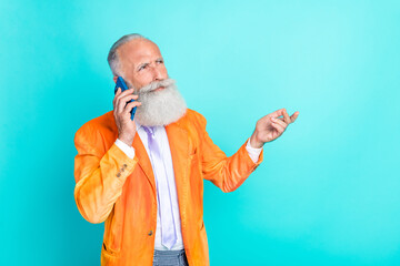 Sticker - Photo of serious successful aged person speak communicate telephone isolated on turquoise color background