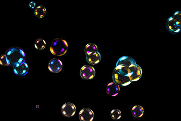 Sticker - Soap bubbles isolated on a black background