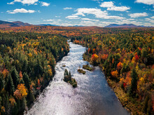 Colorful Fall Trees Around The Saranac River Near Redford In The Adirondacks In New York State In The Autumn