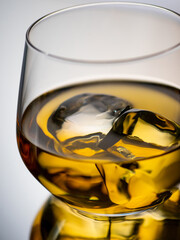 Wall Mural - Whisky on the rocks, glass filled with ice cubes, close-up shot
