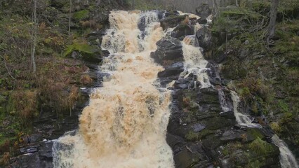 Wall Mural - Big picturesque waterfall Jukankoski in the autumn forest. Karelia, Russia. 