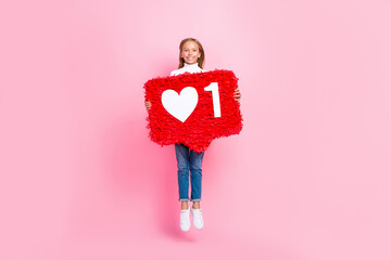 Sticker - Full length photo of cheerful energetic girl jumping hands hold large like collage isolated on pink color background