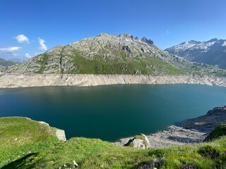 Artificial reservoir lake Lago di Lucendro or accumulation lake Lucendro in the Swiss alpine area of the St. Gotthard Pass (Gotthardpass), Airolo - Canton of Ticino (Tessin), Switzerland (Schweiz)