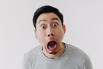 Wall Mural - Funny shocked surprised closeup asian face man isolated on white background.