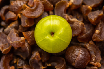 Wall Mural - digestive dried amla candy with fresh Indian gooseberry