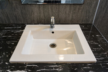 Bathroom interior with white wash basin and faucet modern.