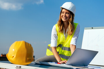 Construction concept of engineer or architect woman working at construction site.