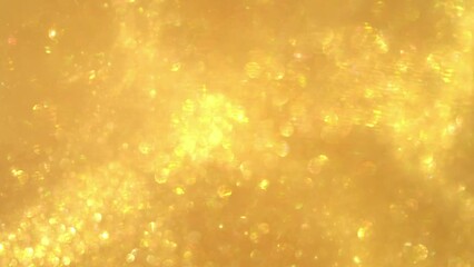 Wall Mural - Waves of golden particles and bokeh. Small particles of gold shiny glitter in the form of moving waves. Luxurious pattern. Real gold flying dust particles. Abstract motion background. 
