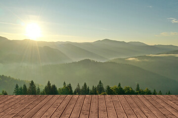 Empty wooden surface and beautiful view of mountain landscape with forest