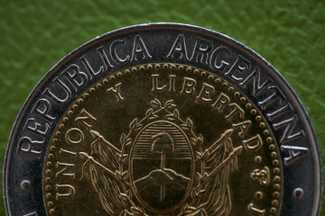 Details of an Argentine coin where it says Argentine Republic and freedom.