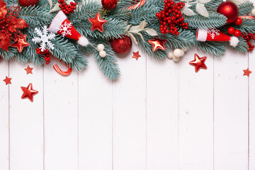 Wall Mural - Christmas composition made from pine tree, stars and festive decorations top view. Christmas flat lay