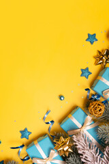 Wall Mural - christmas background with pine tree, gifts and festive decorations top view. christmas flat lay. cop