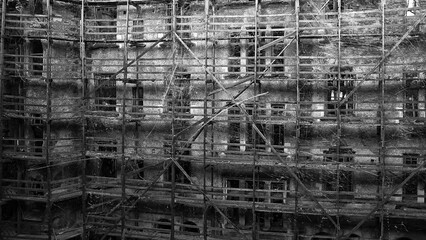 Poster - an old ruined building with flashing white scratches