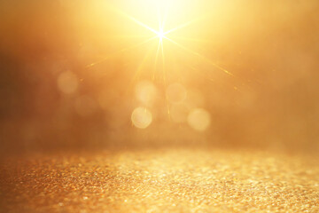 background of abstract glitter lights. gold and silver. de focused