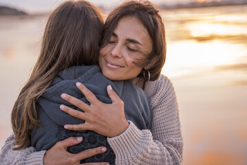 Wall Mural - Two beautiful female friends having a warm moment together