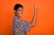 Profile photo of excited delighted person raise fist luck achievement isolated on orange color background
