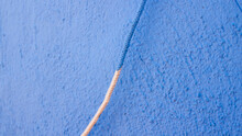 Cuerda Pintada De Azul En Pared Azul