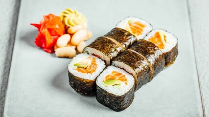 Poster - Set of delicious fresh sushi rolls served on a white plate