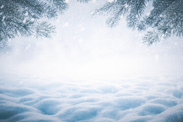 Winter Christmas background with snowy pine branches and snow heap