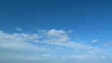 Clouds Move In The Blue Sky. Tropical Sky At Day Time, Only White And Blue Colors. Semi-transparent Layers On Different Height. Timelapse.