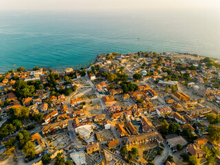 Wall Mural - Aerial top view of Side, a resort town, in Antalya Province, Turkey, surrounded by the Mediterranean Sea. The roofs of the buildings, turquoise sea water. High quality photo