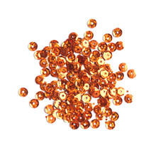 Pile Of Orange Sequins Isolated On White, Top View