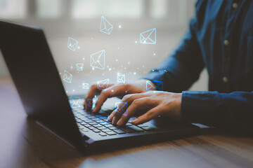 Poster - Email Marketing and Newsletters, Technology and lifestyle concepts. Man's hand using computer laptop and sending online message with email icon.