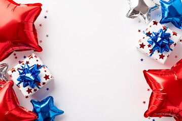 USA Independence Day decorations concept. Top view photo of present boxes with ribbon bows red white blue balloons and star shaped confetti on isolated white background with empty space