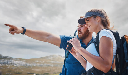 Wall Mural - Pointing, travel and couple hiking on the mountains in a natural environment for an outdoors adventure in Canada. Freedom, lifestyle and healthy woman loves walking or trekking with partner in nature