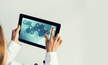Close Of Female Doctor Hands Working With Tablet Pc Computer