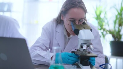 Wall Mural - researcher use microscope and chemical test tube,medical science technology research work for test a