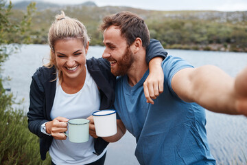 Canvas Print - Nature, camping and selfie couple with coffee drink happy with adventure vacation at Mexico lake. Holiday, relax and happiness of people enjoying warm beverage in camper mug photograph.