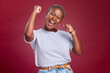© C D/peopleimages.com - Celebration, black woman and excited person showing happiness and winner feeling. Winning motivation, achievement and happy smile of a female win with a celebrate victory feeling from success