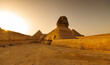 Beautiful wide angle travel view of the Sphinx landmark in Giza pyramid complex from Cairo, Egypt.