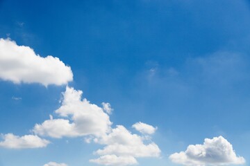 Wall Mural - White clouds and blue sky background on daylight