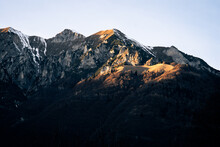 The Last Light Of The Day Enlighten The Peak Of A Mountain Near Lake Garda, Northern Italy