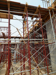 Wall Mural - JOHOR, MALAYSIA -APRIL 13, 2016: Scaffolding used as the temporary structure to support platform, form work and structure at the construction site. Also used it as a walking platform for workers. 