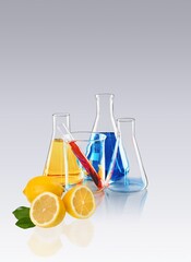 Wall Mural - FFresh ripe lemon and glass tubes equipment