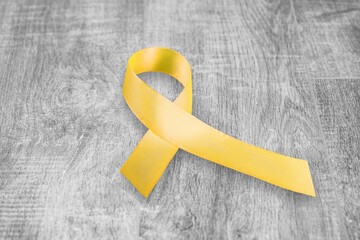 Wall Mural - Yellow ribbon for support of cancer awareness