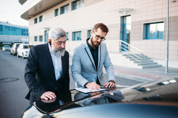 business people working outside office building