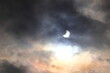 A dramatic solar eclipse. Dark leaden clouds in the sky. Eclipse of 2022