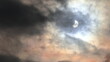 A dramatic solar eclipse. Dark leaden clouds in the sky. Eclipse of 2022