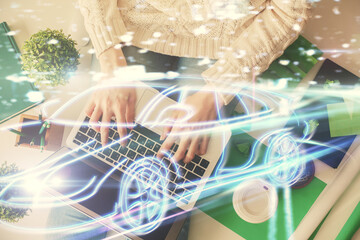 Poster - Double exposure of woman hands working on computer and car hologram drawing. Top View. Auto pilot concept.