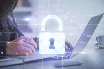 Poster - Double exposure of woman hands working on computer and lock hologram drawing. Security concept.