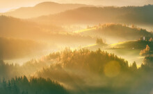 Misty Sunrise Over The Mountains