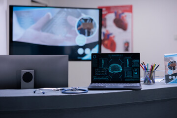 Wall Mural - Tomography displayed on laptop screen in medical clinic desk. Brain x ray with diagnostic information on specialist computer. Results of medical examination on notebook on hospital office desk.