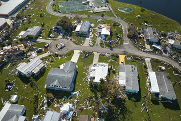 Poster - Badly damaged mobile homes after hurricane Ian in Florida residential area. Consequences of natural disaster