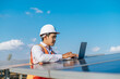 © Johnstocker - Young Asian technician man checking operation photovoltaic solar panel