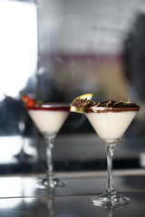 Wall Mural - white sweet strawberry ganache dessert with chocolate and lemon zest served in a glass bowl.